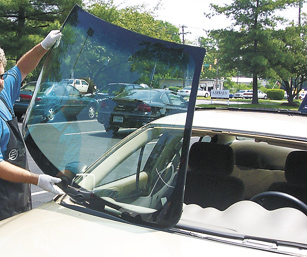 picture of PF Auto Glass Inc performing a windshield replacement in a parking lot